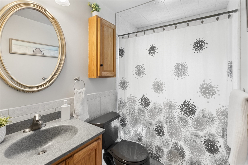 30 Samoset Road Woburn, MA 01801 - Photo 15 of 35 a bathroom with a sink toilet and shower