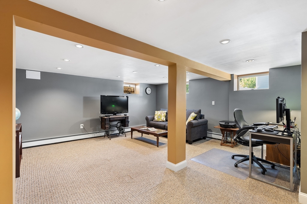 30 Samoset Road Woburn, MA 01801 - Photo 24 of 35 a room with furniture and a flat screen tv