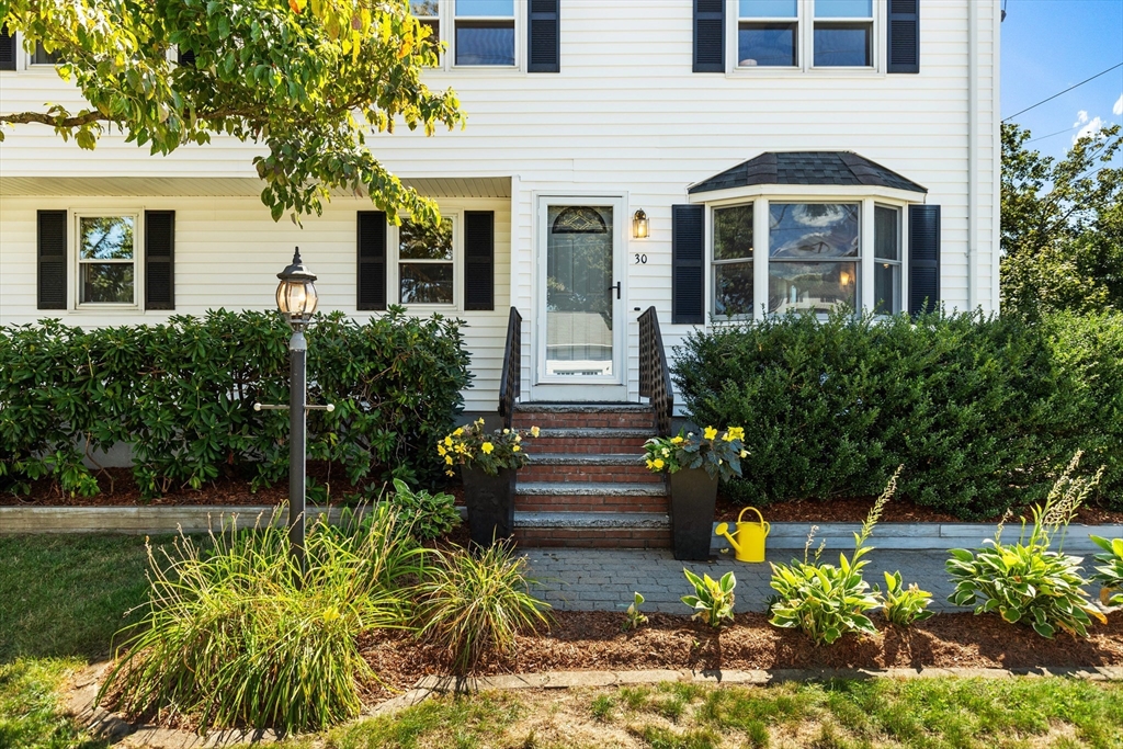 30 Samoset Road Woburn, MA 01801 - Photo 28 of 35 a front view of a house with a garden
