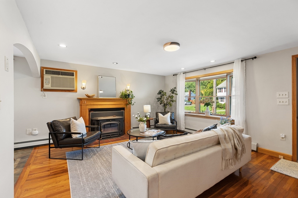 30 Samoset Road Woburn, MA 01801 - Photo 3 of 35 a living room with furniture and a fireplace