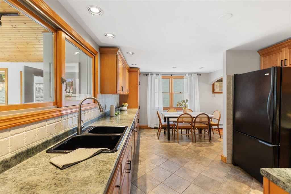 30 Samoset Road Woburn, MA 01801 - Photo 8 of 35 a kitchen with granite countertop a refrigerator and a sink