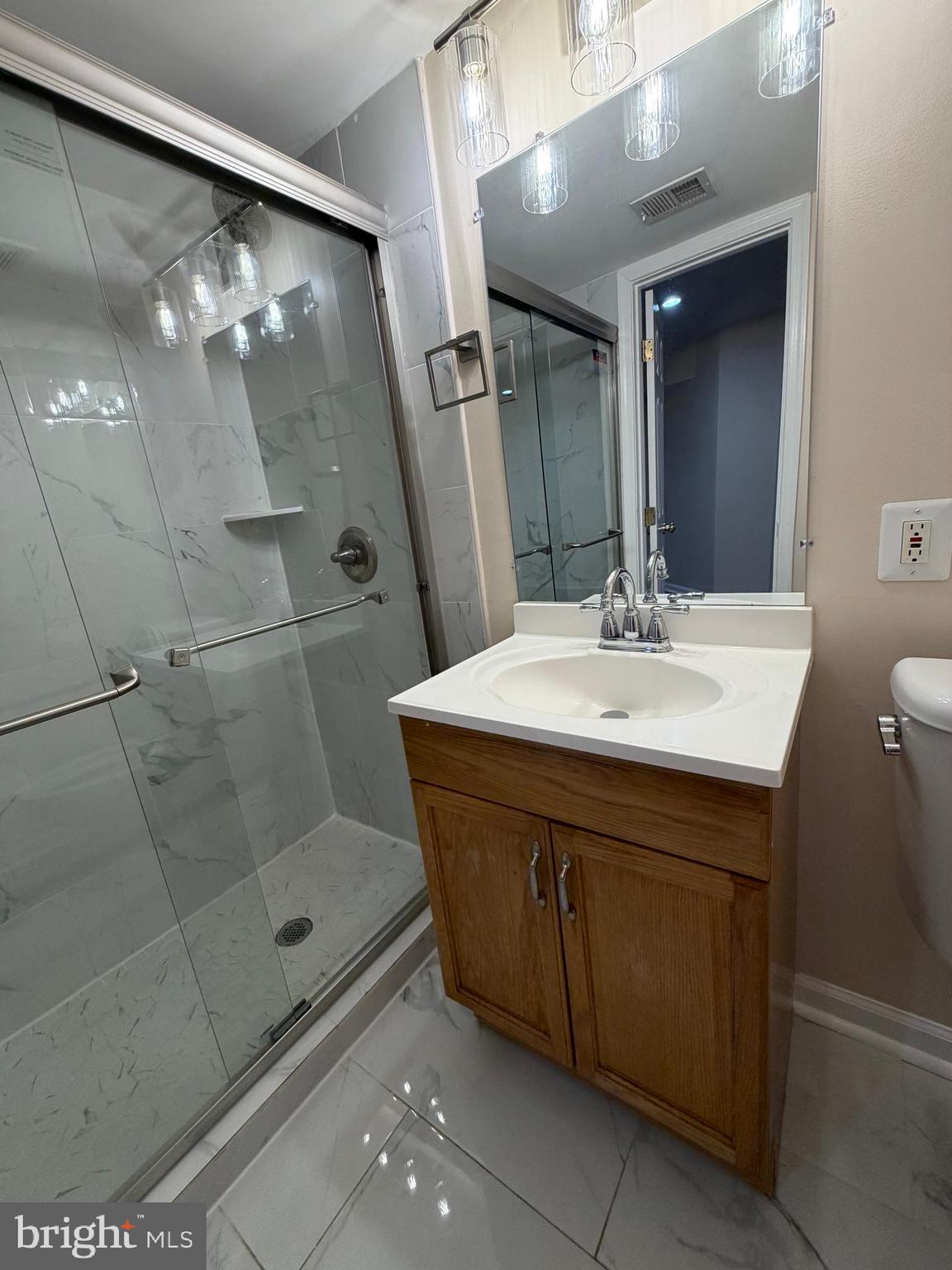 13952 Bishops Bequest Road Upper Marlboro, MD 20772 - Photo 23 of 28 a bathroom with a sink and a mirror