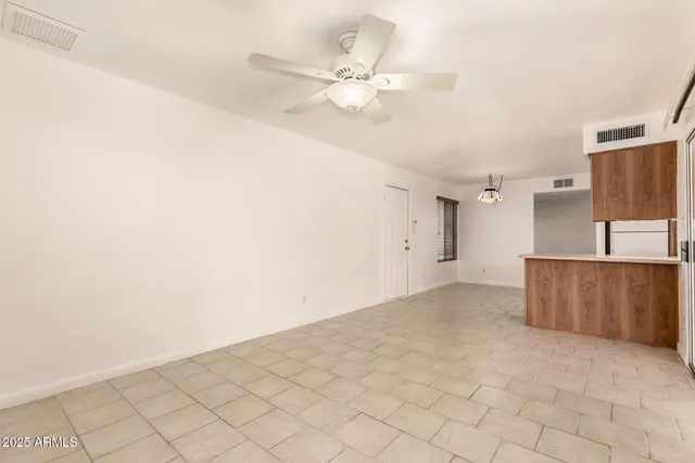 a view of kitchen with cabinets