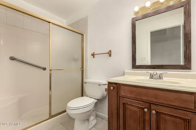 a bathroom with a shower and a toilet