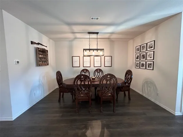 a living room with furniture window and a flat screen tv