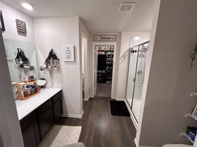 a bathroom with a shower and a tub