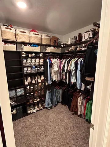 a living room with furniture and a air conditioner vent