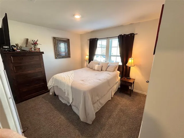 a bed room with a bed and a couch