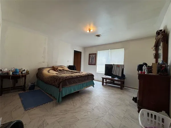 a bedroom with a bed and furniture