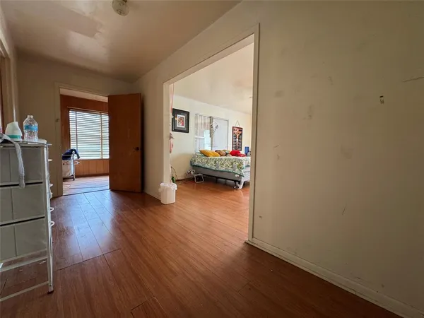 a view of a livingroom with furniture and wooden floor