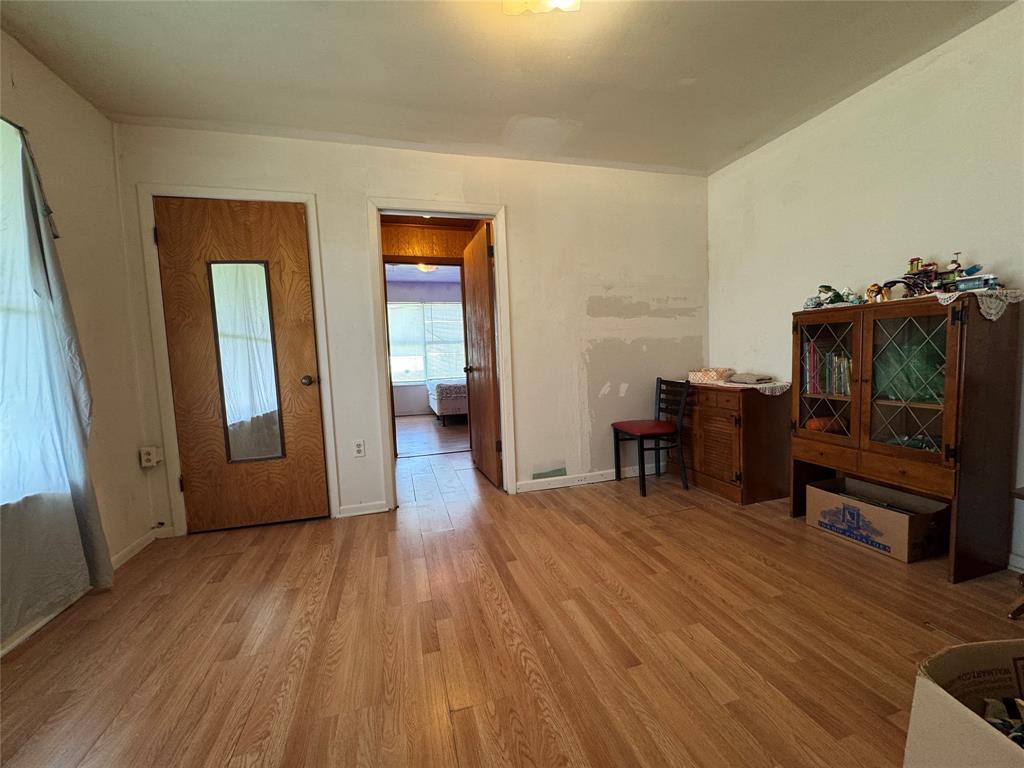 733 Foster Street Marlin, TX 76661 - Photo 21 of 40 a view of a livingroom with wooden floor and furniture