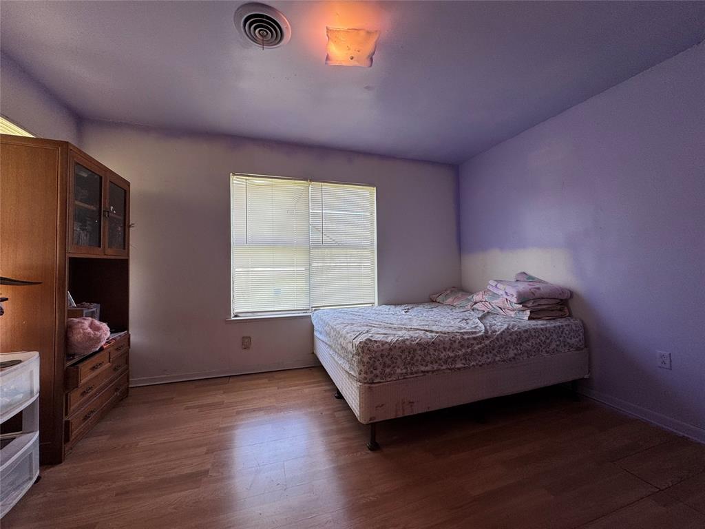 733 Foster Street Marlin, TX 76661 - Photo 24 of 40 a bedroom with a bed and a window