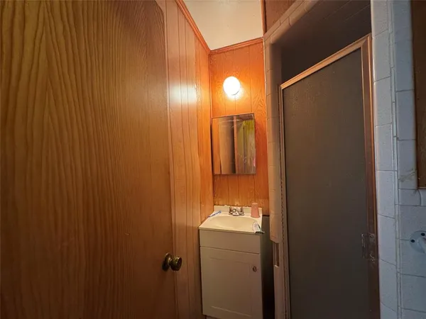 a bathroom with a sink and mirror