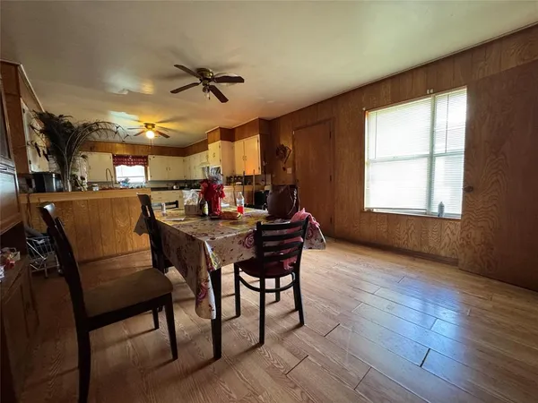 a dining room with furniture and window