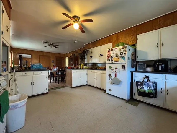 a view of a kitchen with furniture and flat screen tv