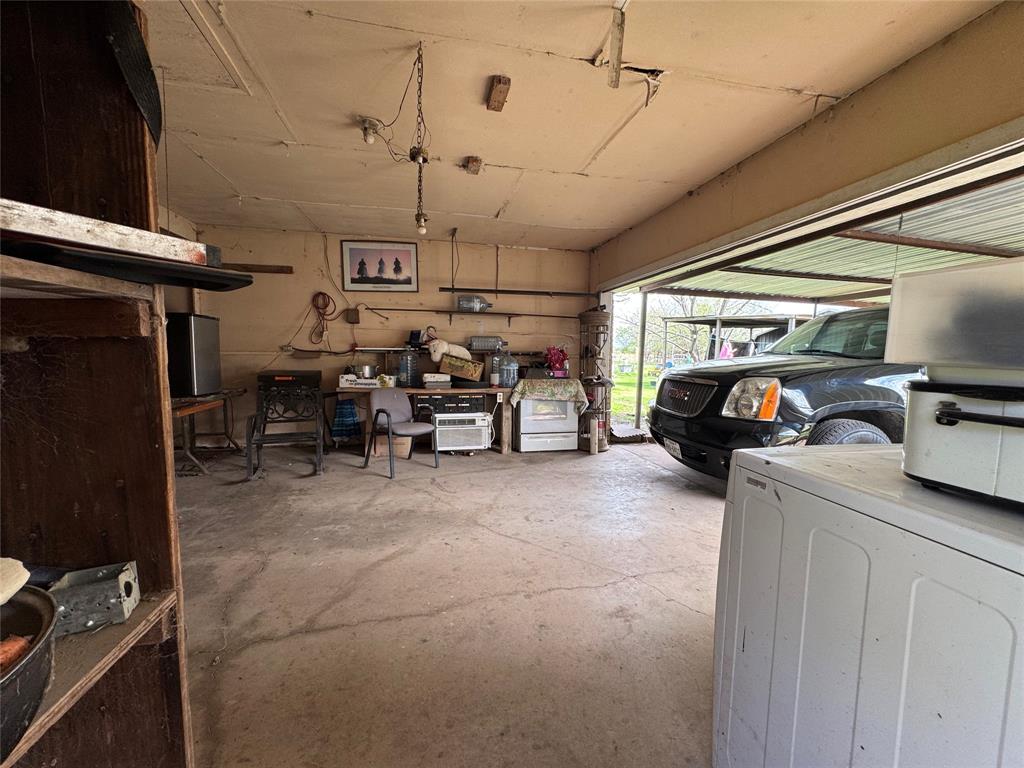 733 Foster Street Marlin, TX 76661 - Photo 32 of 40 a living room with furniture a flat screen tv and a window
