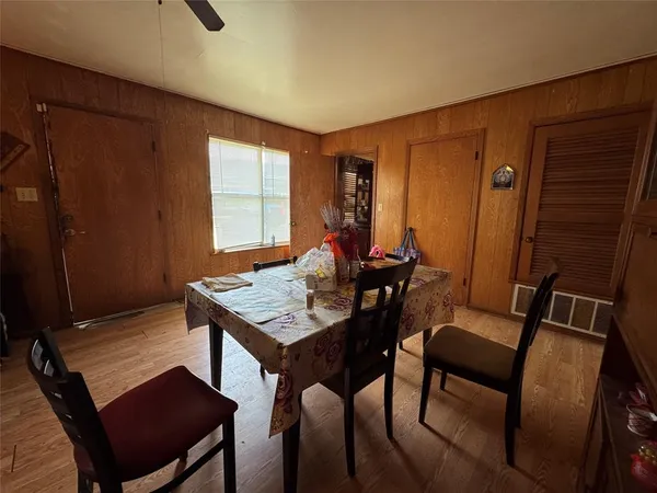 a view of a dining room with furniture and window