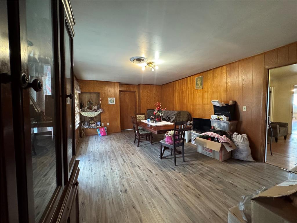 733 Foster Street Marlin, TX 76661 - Photo 6 of 40 a living room with furniture and a wooden floor