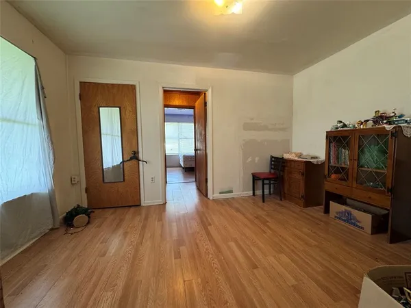 a view of a livingroom with furniture and a flat screen tv