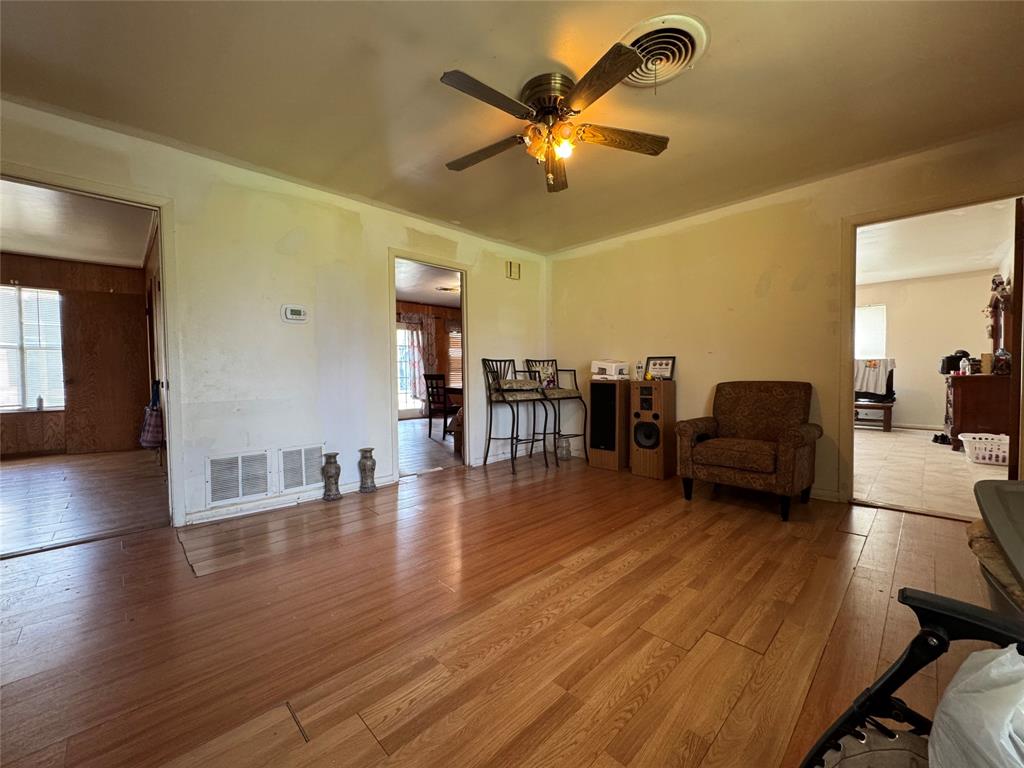 733 Foster Street Marlin, TX 76661 - Photo 10 of 40 a living room with furniture and a chandelier