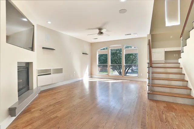 a view of an entryway with wooden floor and a window
