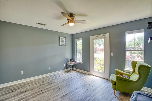 a living room with furniture and a window