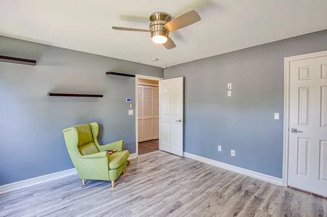 a view of dining room with furniture and a chandelier