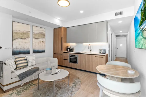 a kitchen with a table and chairs