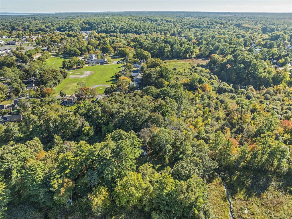 235 Main Street Marshfield, MA 02050 - Photo 12 of 15 an aerial view of residential houses with outdoor space and trees