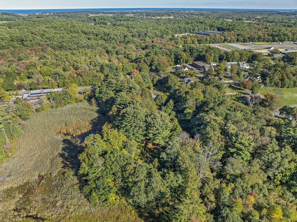 235 Main Street Marshfield, MA 02050 - Photo 10 of 15 an aerial view of residential houses with outdoor space and trees