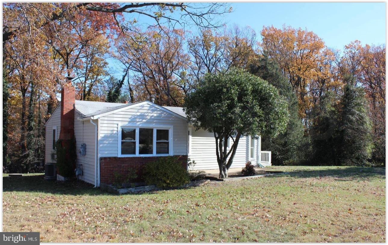 Charming home amid autumn hues.