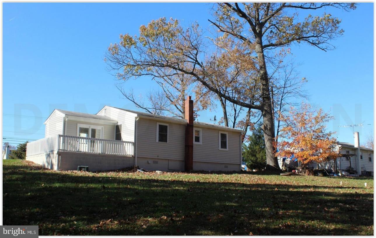 3735 West Ox Road Fairfax, VA 22033 - Photo 19 of 23 Charming home under a clear blue sky.