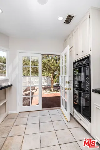 a hallway with a washer and dryer