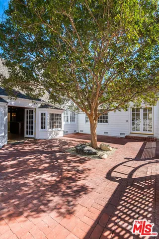 a view of house with swimming pool outdoor seating