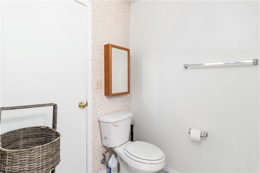 2192 Aspen Mirror Way, Unit 102 Laughlin, NV 89029 - Photo 22 of 58 Bathroom featuring wallpapered walls