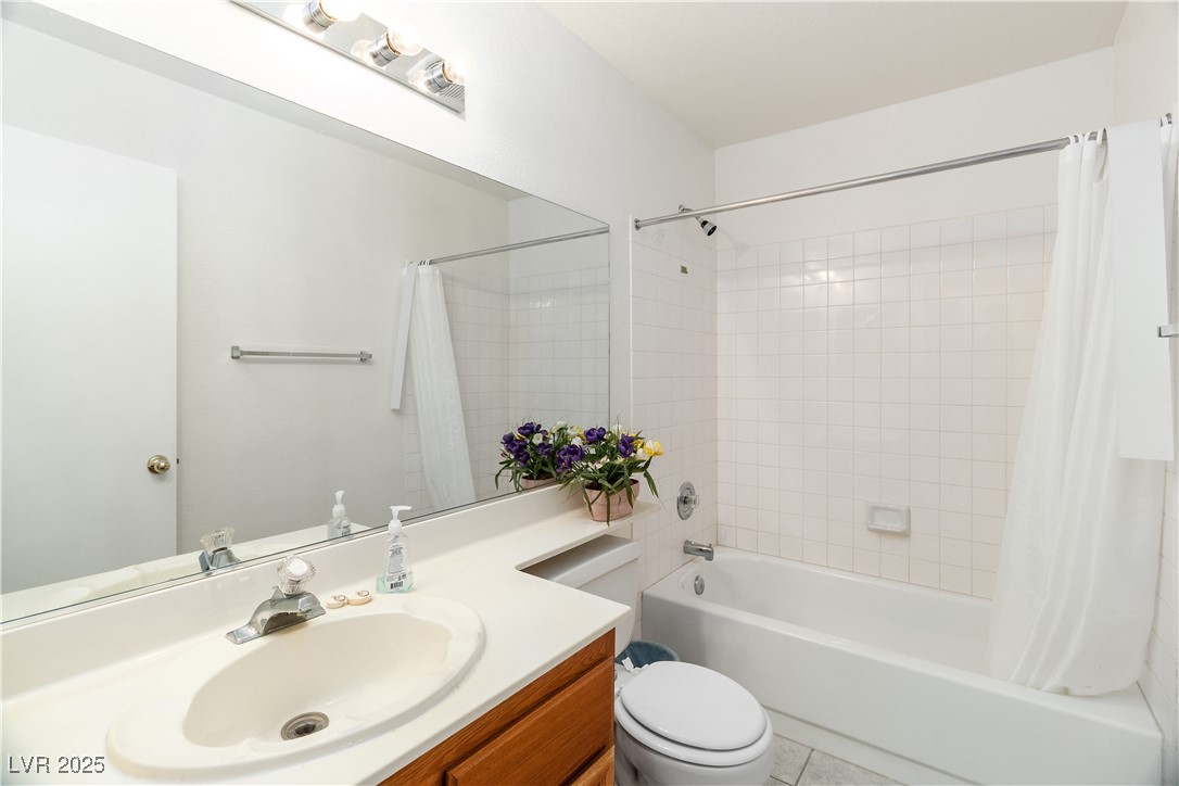 2192 Aspen Mirror Way, Unit 102 Laughlin, NV 89029 - Photo 28 of 58 Primary Ensuite Full Bathroom featuring shower / tub combo, vanity, and light tile patterned floors