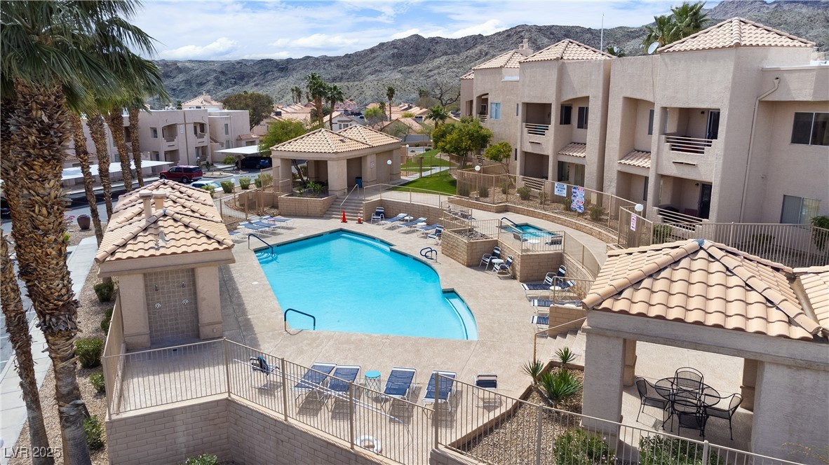 2192 Aspen Mirror Way, Unit 102 Laughlin, NV 89029 - Photo 56 of 58 Community pool with a patio area, a mountain view, and a residential view