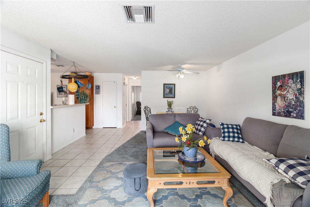 2192 Aspen Mirror Way, Unit 102 Laughlin, NV 89029 - Photo 10 of 58 living room with a textured ceiling