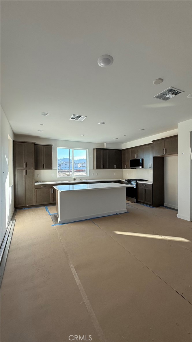 1722 River Vista Way Lompoc, CA 93436 - Photo 5 of 13 a view of a kitchen with a sink and an empty room