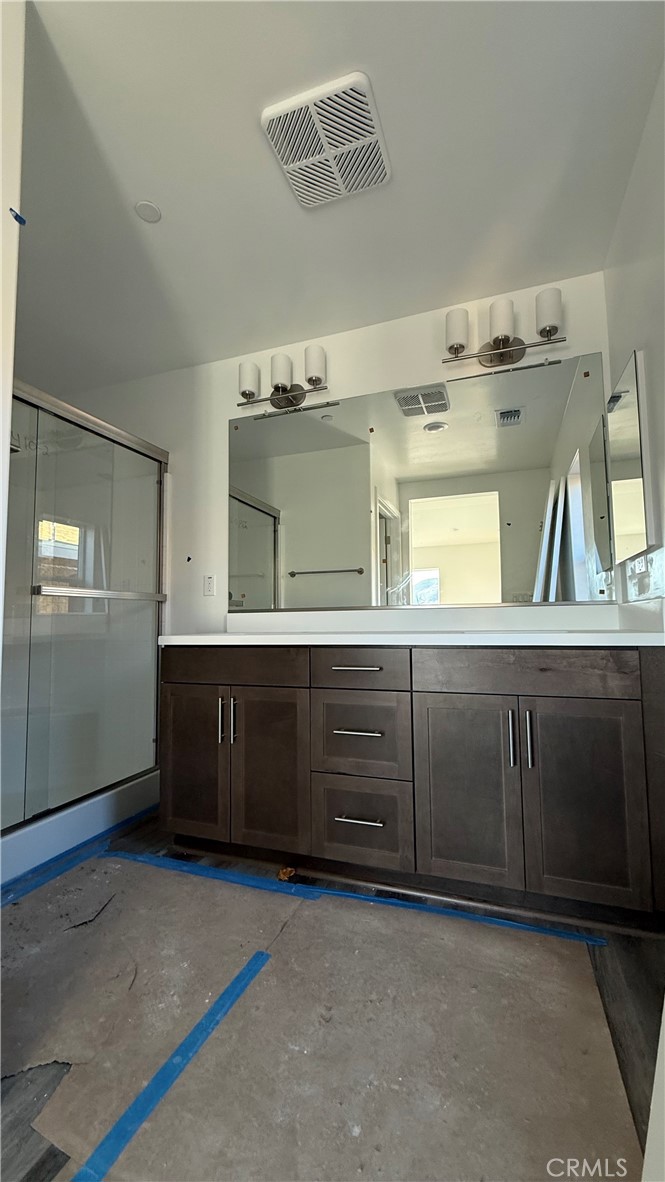 1722 River Vista Way Lompoc, CA 93436 - Photo 8 of 13 a bathroom with a sink vanity and mirror