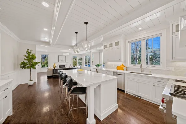 a view of a wooden chairs and bench on the wooden floor