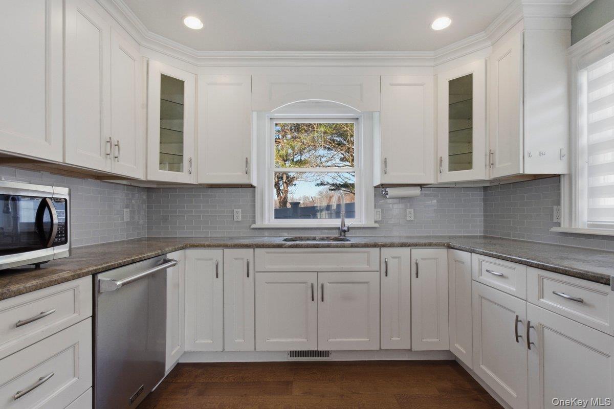 246 Tibbetts Road Yonkers, NY 10705 - Photo 10 of 27 Kitchen featuring glass fronted cabinets, white cabinetry, recessed lighting