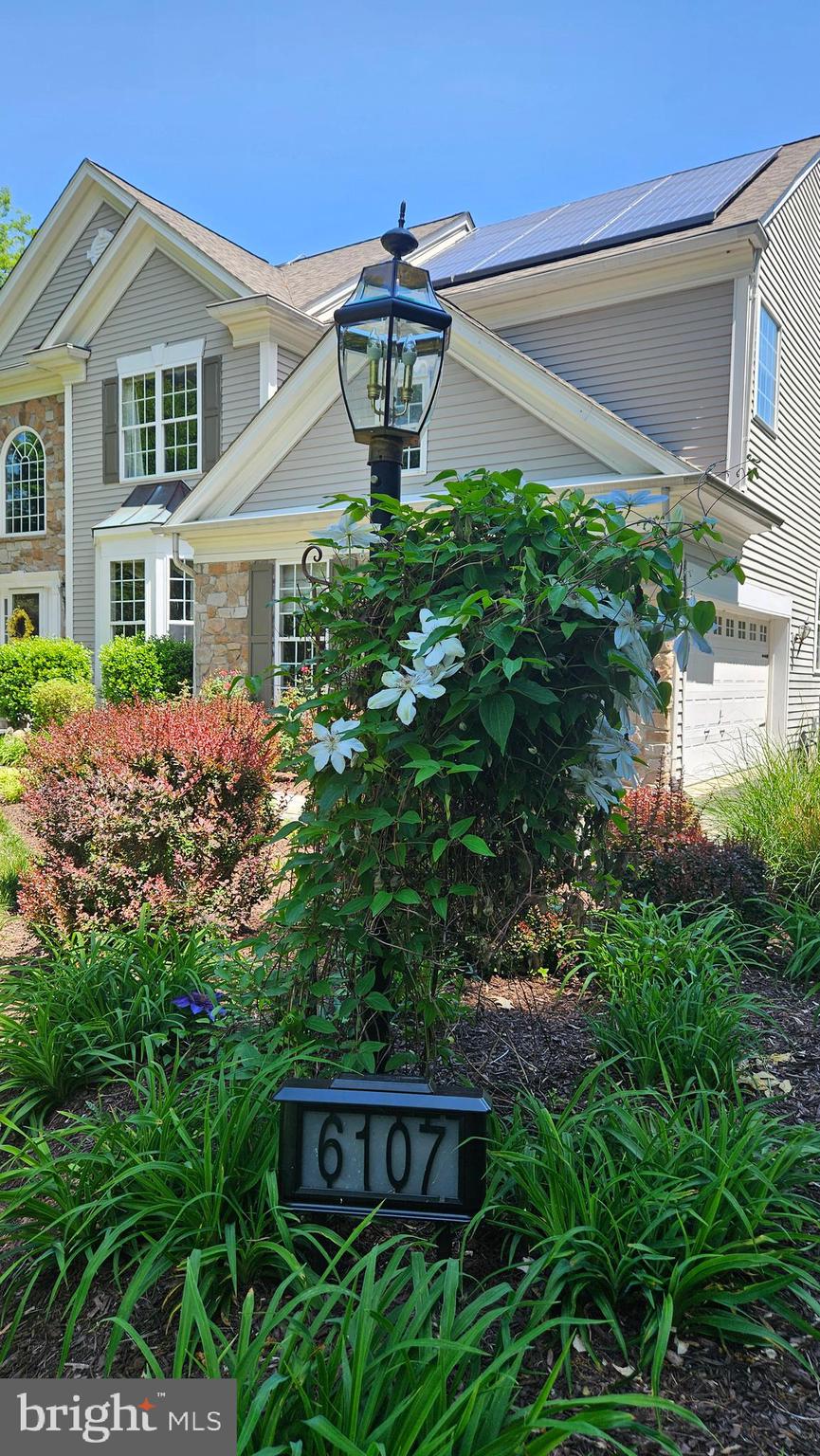 6107 Traceys Overlook Road Tracys Landing, MD 20779 - Photo 46 of 67 a front view of a house with garden