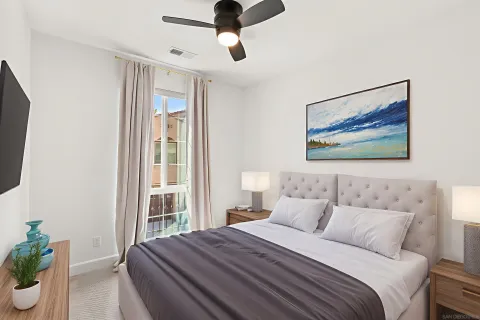 a bedroom with a bed and a window