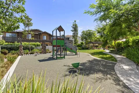 a view of a garden with a building in the background