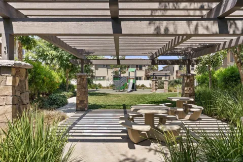 a view of a park with swings and slides