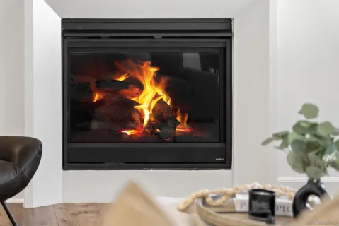 a living room with furniture kitchen view and a table