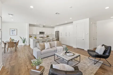 a living room with furniture fireplace and window