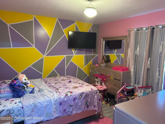 a bedroom with bed and window