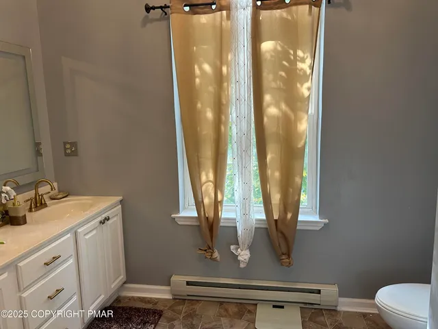 a bathroom with a mirror and a sink